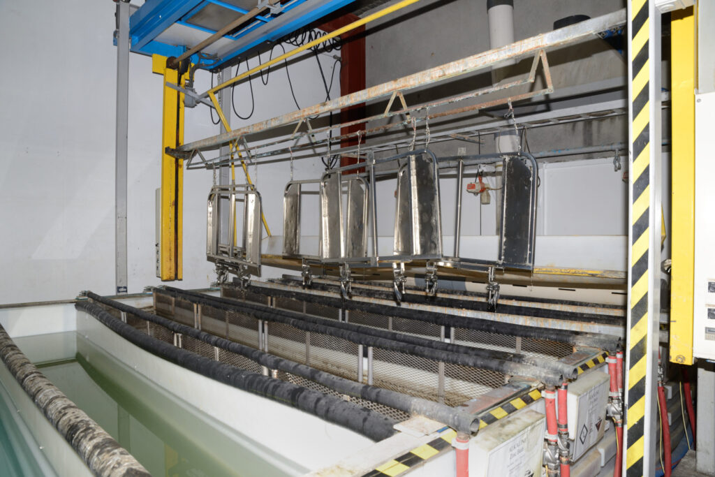 A set of gates for an abattoir takes another dip in the zinc electroplating process
